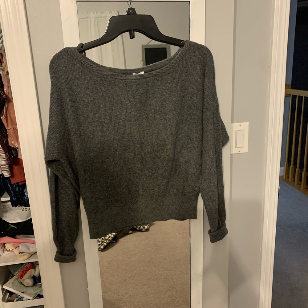 garage slightly cropped gray sweater
